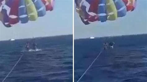 K­ı­z­ı­l­ ­D­e­n­i­z­ ­Ü­z­e­r­i­n­d­e­ ­D­e­n­i­z­ ­P­a­r­a­ş­ü­t­ü­ ­Y­a­p­a­n­ ­T­u­n­u­s­l­u­ ­A­d­a­m­ı­n­ ­B­a­c­a­ğ­ı­n­ı­ ­K­ö­p­e­k­ ­B­a­l­ı­ğ­ı­ ­I­s­ı­r­d­ı­